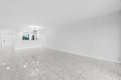 Beautifully renovated home with an amazing lake and golf view in on  in Florida - for sale on GolfHomes.com, golf home, golf lot
