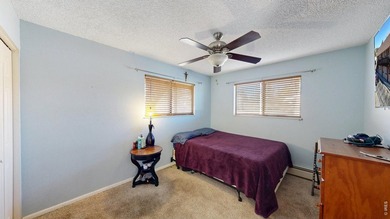 Wake up to mountain views and fresh alpine air in this 2-bedroom on Lake Estes Golf Course in Colorado - for sale on GolfHomes.com, golf home, golf lot