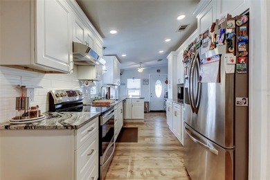 Welcome home to this beautifully updated three-bedroom, two-bath on Palm Hill Golf Club in Florida - for sale on GolfHomes.com, golf home, golf lot