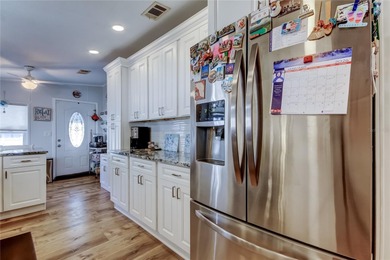 Welcome home to this beautifully updated three-bedroom, two-bath on Palm Hill Golf Club in Florida - for sale on GolfHomes.com, golf home, golf lot