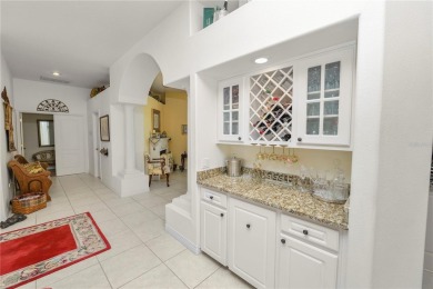 This is an immaculate 4 bedroom / 3 Bathroom one level Pool home on Grasslands Golf and Country Club in Florida - for sale on GolfHomes.com, golf home, golf lot