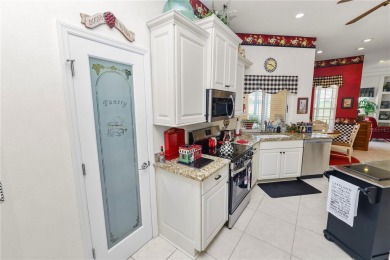 This is an immaculate 4 bedroom / 3 Bathroom one level Pool home on Grasslands Golf and Country Club in Florida - for sale on GolfHomes.com, golf home, golf lot