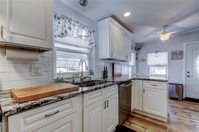 Welcome home to this beautifully updated three-bedroom, two-bath on Palm Hill Golf Club in Florida - for sale on GolfHomes.com, golf home, golf lot