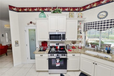 This is an immaculate 4 bedroom / 3 Bathroom one level Pool home on Grasslands Golf and Country Club in Florida - for sale on GolfHomes.com, golf home, golf lot