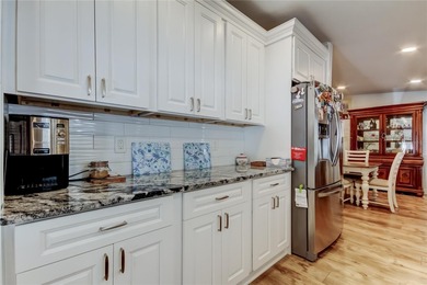 Welcome home to this beautifully updated three-bedroom, two-bath on Palm Hill Golf Club in Florida - for sale on GolfHomes.com, golf home, golf lot