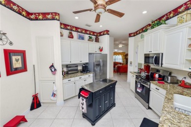 This is an immaculate 4 bedroom / 3 Bathroom one level Pool home on Grasslands Golf and Country Club in Florida - for sale on GolfHomes.com, golf home, golf lot