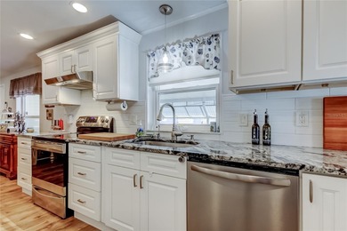 Welcome home to this beautifully updated three-bedroom, two-bath on Palm Hill Golf Club in Florida - for sale on GolfHomes.com, golf home, golf lot