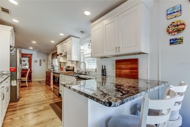 Welcome home to this beautifully updated three-bedroom, two-bath on Palm Hill Golf Club in Florida - for sale on GolfHomes.com, golf home, golf lot