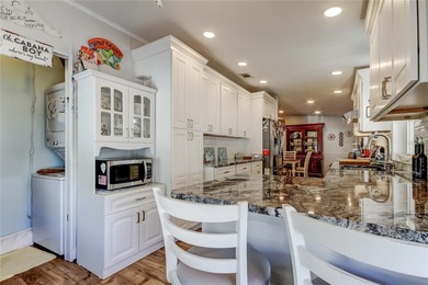 Welcome home to this beautifully updated three-bedroom, two-bath on Palm Hill Golf Club in Florida - for sale on GolfHomes.com, golf home, golf lot