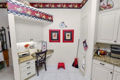 This is an immaculate 4 bedroom / 3 Bathroom one level Pool home on Grasslands Golf and Country Club in Florida - for sale on GolfHomes.com, golf home, golf lot