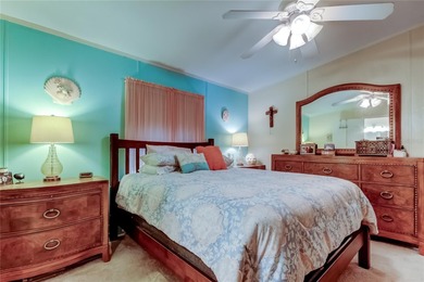 Welcome home to this beautifully updated three-bedroom, two-bath on Palm Hill Golf Club in Florida - for sale on GolfHomes.com, golf home, golf lot