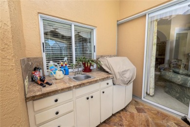 This is an immaculate 4 bedroom / 3 Bathroom one level Pool home on Grasslands Golf and Country Club in Florida - for sale on GolfHomes.com, golf home, golf lot