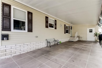 Welcome home to this beautifully updated three-bedroom, two-bath on Palm Hill Golf Club in Florida - for sale on GolfHomes.com, golf home, golf lot