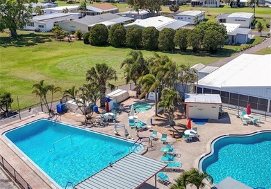 Welcome home to this beautifully updated three-bedroom, two-bath on Palm Hill Golf Club in Florida - for sale on GolfHomes.com, golf home, golf lot