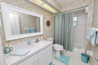 This is an immaculate 4 bedroom / 3 Bathroom one level Pool home on Grasslands Golf and Country Club in Florida - for sale on GolfHomes.com, golf home, golf lot