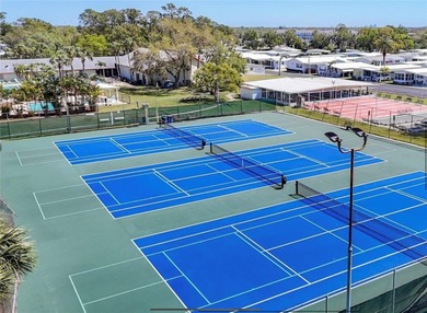 Welcome home to this beautifully updated three-bedroom, two-bath on Palm Hill Golf Club in Florida - for sale on GolfHomes.com, golf home, golf lot