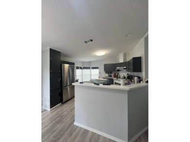 Charming Updated and Modern home with privacy and stunning water on Lake Henry Golf Club in Florida - for sale on GolfHomes.com, golf home, golf lot