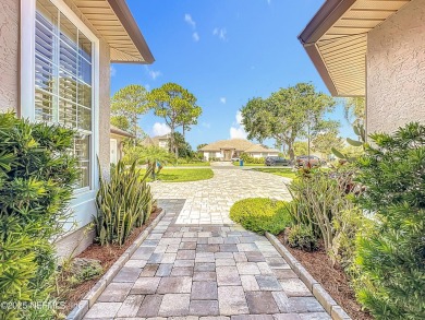Immaculate concrete block home with high and coffered ceilings on Marsh Creek Country Club in Florida - for sale on GolfHomes.com, golf home, golf lot