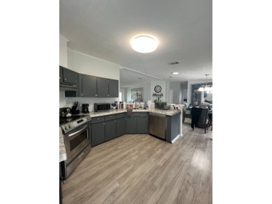 Charming Updated and Modern home with privacy and stunning water on Lake Henry Golf Club in Florida - for sale on GolfHomes.com, golf home, golf lot