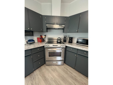 Charming Updated and Modern home with privacy and stunning water on Lake Henry Golf Club in Florida - for sale on GolfHomes.com, golf home, golf lot