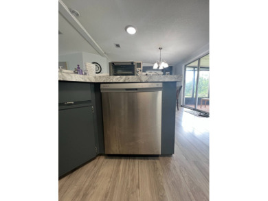 Charming Updated and Modern home with privacy and stunning water on Lake Henry Golf Club in Florida - for sale on GolfHomes.com, golf home, golf lot