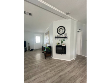 Charming Updated and Modern home with privacy and stunning water on Lake Henry Golf Club in Florida - for sale on GolfHomes.com, golf home, golf lot