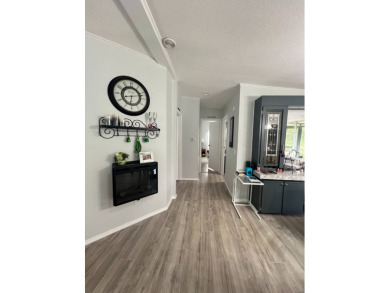 Charming Updated and Modern home with privacy and stunning water on Lake Henry Golf Club in Florida - for sale on GolfHomes.com, golf home, golf lot