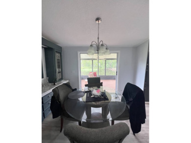 Charming Updated and Modern home with privacy and stunning water on Lake Henry Golf Club in Florida - for sale on GolfHomes.com, golf home, golf lot