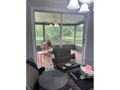 Charming Updated and Modern home with privacy and stunning water on Lake Henry Golf Club in Florida - for sale on GolfHomes.com, golf home, golf lot