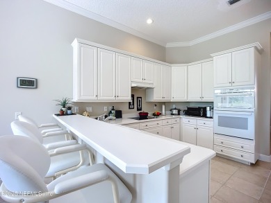 Immaculate concrete block home with high and coffered ceilings on Marsh Creek Country Club in Florida - for sale on GolfHomes.com, golf home, golf lot