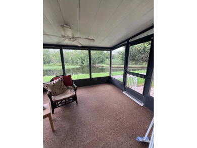 Charming Updated and Modern home with privacy and stunning water on Lake Henry Golf Club in Florida - for sale on GolfHomes.com, golf home, golf lot