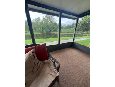 Charming Updated and Modern home with privacy and stunning water on Lake Henry Golf Club in Florida - for sale on GolfHomes.com, golf home, golf lot