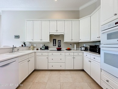 Immaculate concrete block home with high and coffered ceilings on Marsh Creek Country Club in Florida - for sale on GolfHomes.com, golf home, golf lot