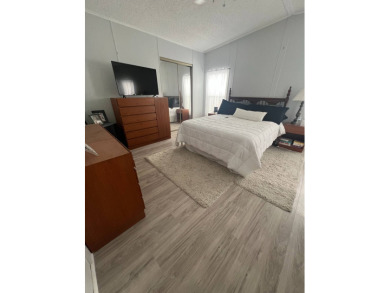 Charming Updated and Modern home with privacy and stunning water on Lake Henry Golf Club in Florida - for sale on GolfHomes.com, golf home, golf lot
