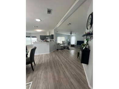 Charming Updated and Modern home with privacy and stunning water on Lake Henry Golf Club in Florida - for sale on GolfHomes.com, golf home, golf lot