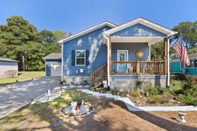 Welcome to this charming 2-bedroom, 2-bath home located just a on Oyster Bay Golf Links in North Carolina - for sale on GolfHomes.com, golf home, golf lot