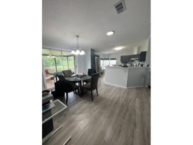 Charming Updated and Modern home with privacy and stunning water on Lake Henry Golf Club in Florida - for sale on GolfHomes.com, golf home, golf lot