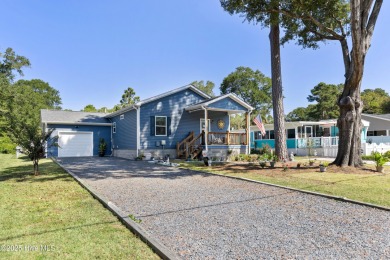 Welcome to this charming 2-bedroom, 2-bath home located just a on Oyster Bay Golf Links in North Carolina - for sale on GolfHomes.com, golf home, golf lot