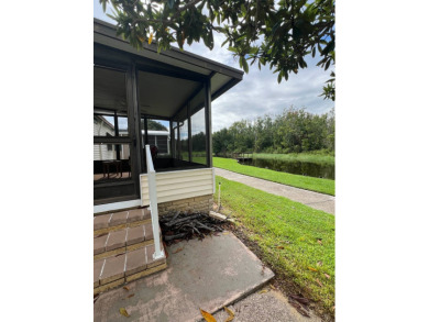 Charming Updated and Modern home with privacy and stunning water on Lake Henry Golf Club in Florida - for sale on GolfHomes.com, golf home, golf lot