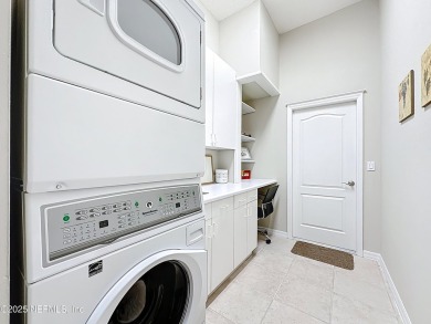 Immaculate concrete block home with high and coffered ceilings on Marsh Creek Country Club in Florida - for sale on GolfHomes.com, golf home, golf lot