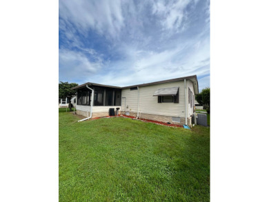 Charming Updated and Modern home with privacy and stunning water on Lake Henry Golf Club in Florida - for sale on GolfHomes.com, golf home, golf lot