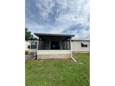 Charming Updated and Modern home with privacy and stunning water on Lake Henry Golf Club in Florida - for sale on GolfHomes.com, golf home, golf lot