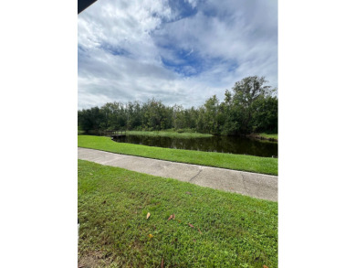 Charming Updated and Modern home with privacy and stunning water on Lake Henry Golf Club in Florida - for sale on GolfHomes.com, golf home, golf lot