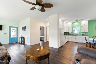 Welcome to this charming 2-bedroom, 2-bath home located just a on Oyster Bay Golf Links in North Carolina - for sale on GolfHomes.com, golf home, golf lot