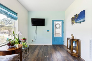 Welcome to this charming 2-bedroom, 2-bath home located just a on Oyster Bay Golf Links in North Carolina - for sale on GolfHomes.com, golf home, golf lot