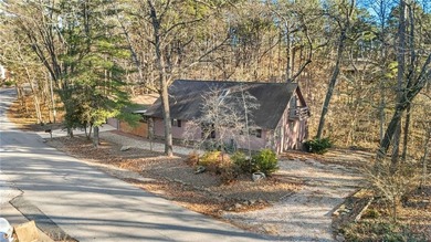 Nestled in Bella Vista, this one-of-a-kind retreat is surrounded on Bella Vista - Metfield Golf Complex and Country Club in Arkansas - for sale on GolfHomes.com, golf home, golf lot