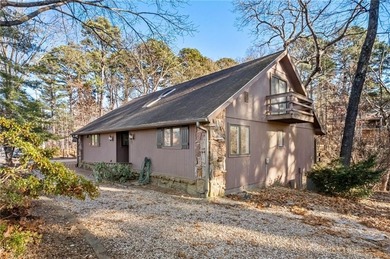 Nestled in Bella Vista, this one-of-a-kind retreat is surrounded on Bella Vista - Metfield Golf Complex and Country Club in Arkansas - for sale on GolfHomes.com, golf home, golf lot