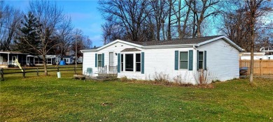 Nestled near Mille lacs lake, this charming year- round home on Izatys Golf and Yacht Club in Minnesota - for sale on GolfHomes.com, golf home, golf lot