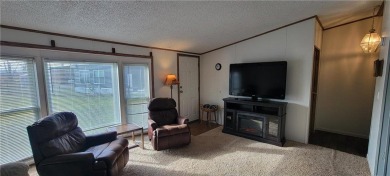 Nestled near Mille lacs lake, this charming year- round home on Izatys Golf and Yacht Club in Minnesota - for sale on GolfHomes.com, golf home, golf lot