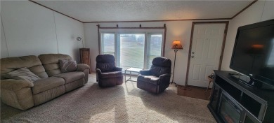 Nestled near Mille lacs lake, this charming year- round home on Izatys Golf and Yacht Club in Minnesota - for sale on GolfHomes.com, golf home, golf lot